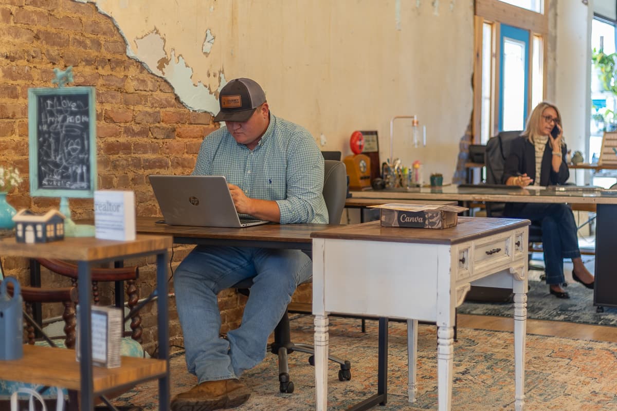 Brantley Ivey and Christy Kilgore working at their desks